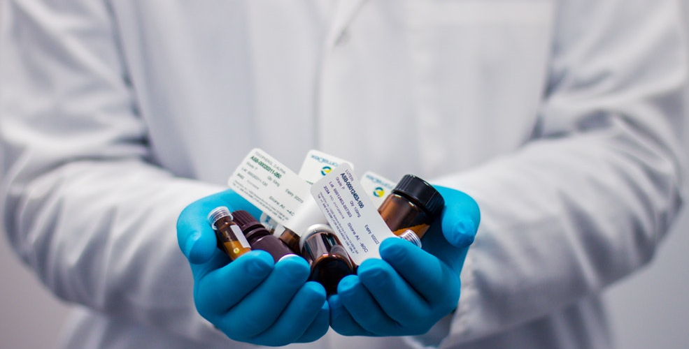 Doctor holding medicine in his hand